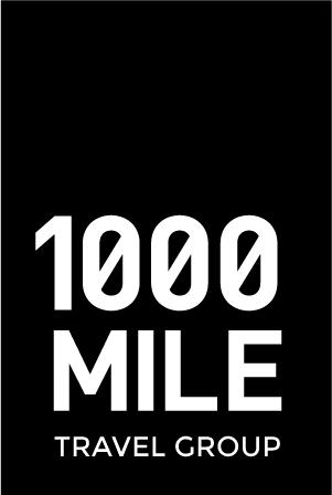 1000 Mile Travel logo
